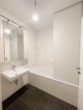 Badezimmer mit Toilette, Badewanne & Waschmaschinenanschluss - Erstbezug! 2‑Zimmer Gartenwohnung mit Garagenplatz und Gemeinschaftsdachterrasse