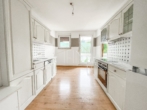 Küche - 4‑Zimmer-​Wohnung mit Balkon und Gemeinschaftsgarten