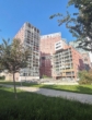 Gebäudeansicht - Traumaussicht! Loggia-Wohnung mit vielen Extras – Fernblick – Pool – Sauna – Fitness!