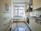 Küche - Attraktive 3‑Zimmer-​Wohnung mit Gemeinschaftsgarten und Parkplatz