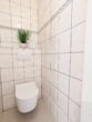 Toilettenraum - BIETERVERFAHREN! Wohnglück mit Garten & Pool – 3‑Zimmer-Rückzugsort zum Ankommen und Wohlfühlen