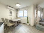 OG: Essbereich - Familienfreundlich & Modern – Maisonette mit Weitblick über Wien und Loggia!